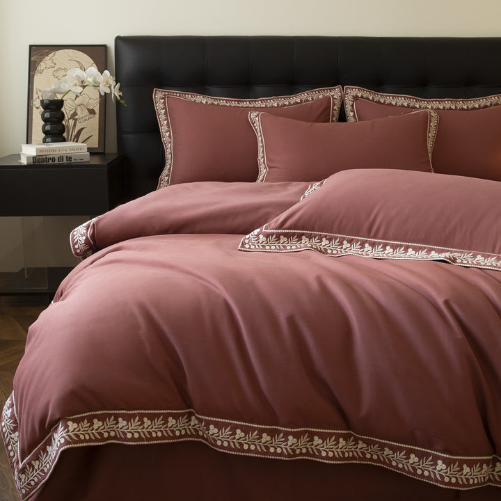 Luxurious embroidered bedding set in cotton satin with decorative trim