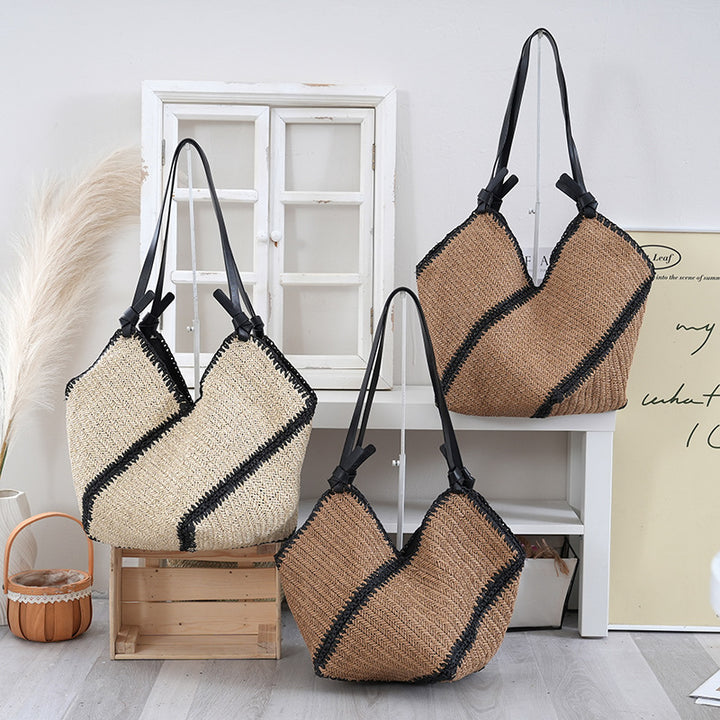 Handbag made of braided natural material with contrasting leather handles Stornfield