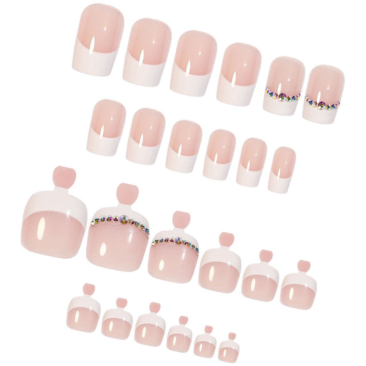 Acrylic nail set with elegant French design and rhinestone embellishments Stornfield