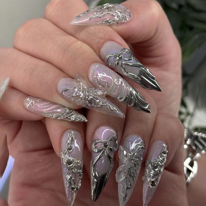 Artful stiletto nails with delicate silver casting decoration Stornfield