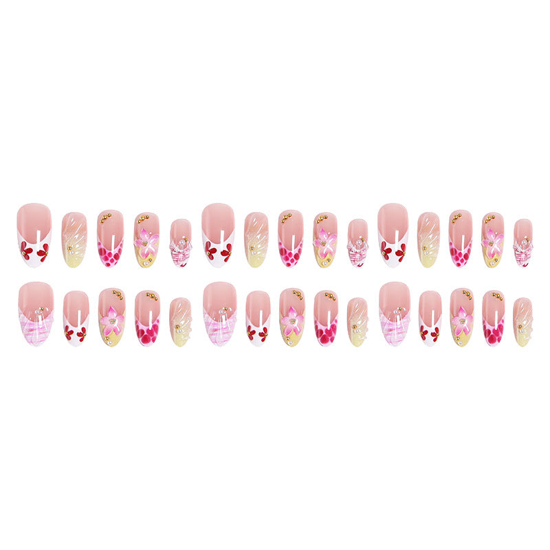 Artificial nails with floral accents and glitter decorations Stornfield