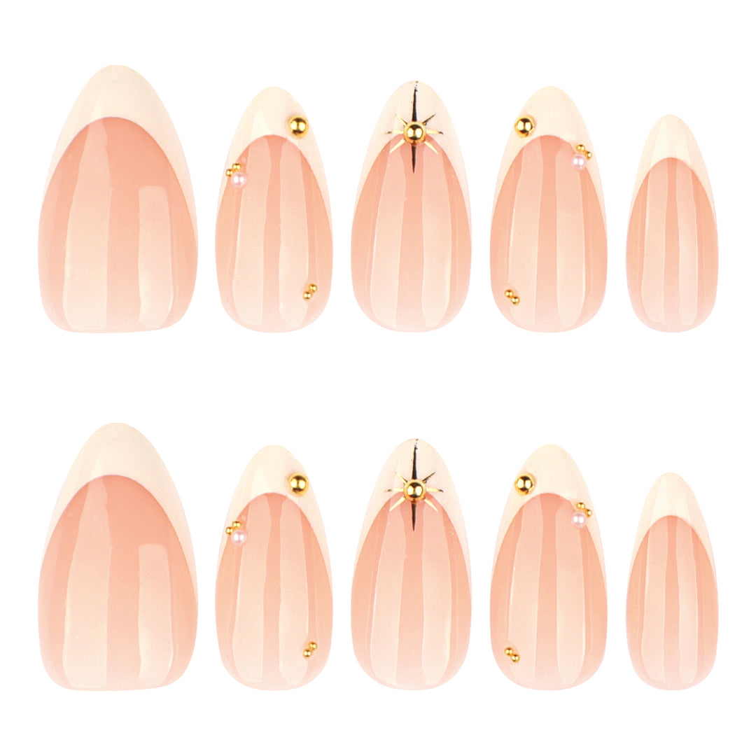 Artistic French-tip nail art with glitter and elegant embellishments Stornfield