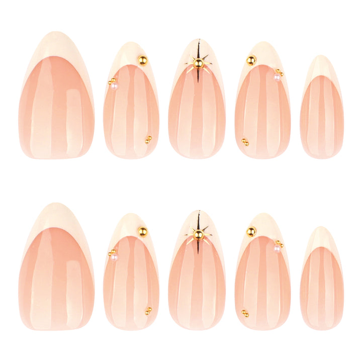 Artistic French-tip nail art with glitter and elegant embellishments Stornfield