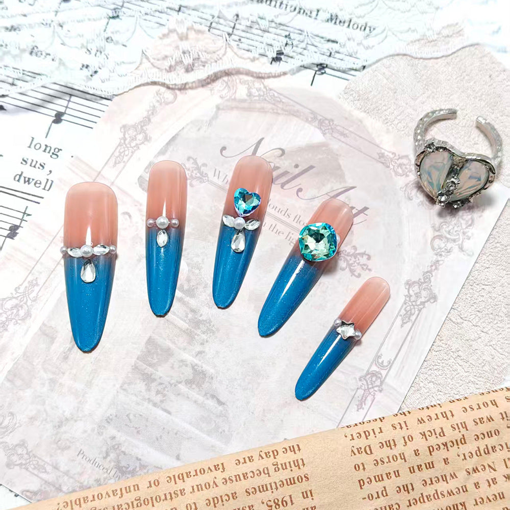 Artificial nails with glitter and rhinestone embellishments Stornfield