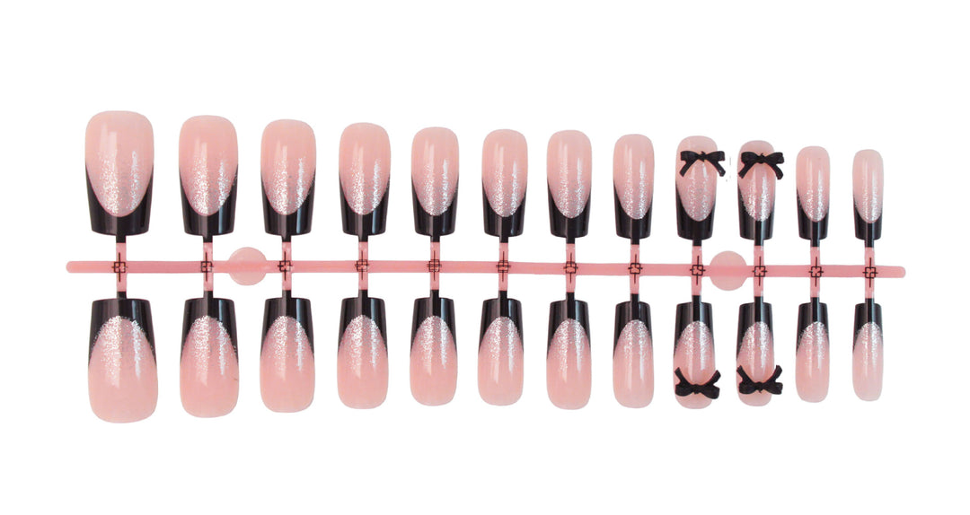 Artificial nail set with elegant glitter accents and bow details Stornfield