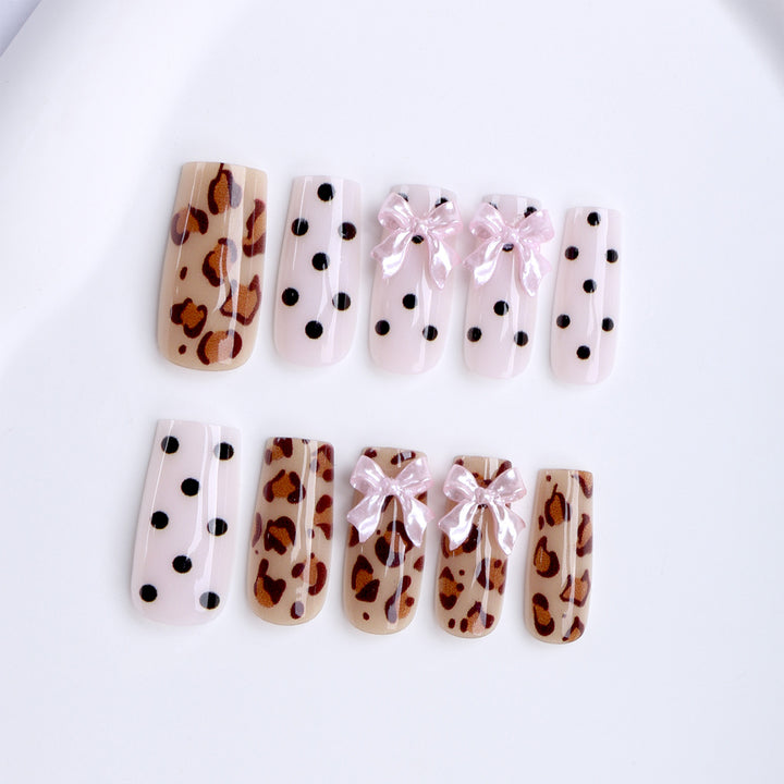Creative artificial nails with bows and dots Stornfield