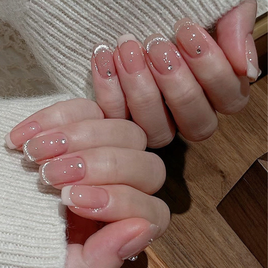 Glamorous artificial nails with filigree rhinestone details Stornfield