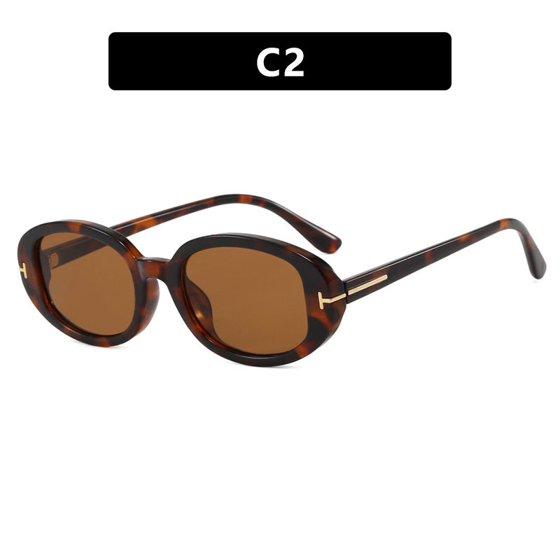 Ladies stylish oval sunglasses with golden details Stornfield
