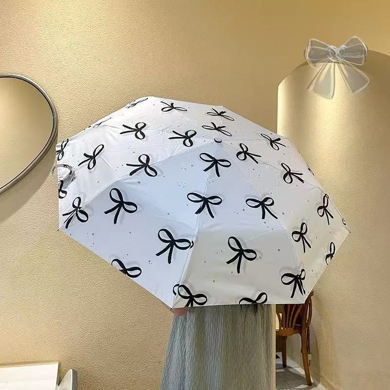 Women's foldable umbrella with elegant bow design Stornfield