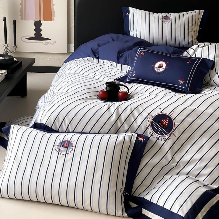 Maritime cotton satin bedding set with fine stripes, nautical embroidery, and reversible pillow