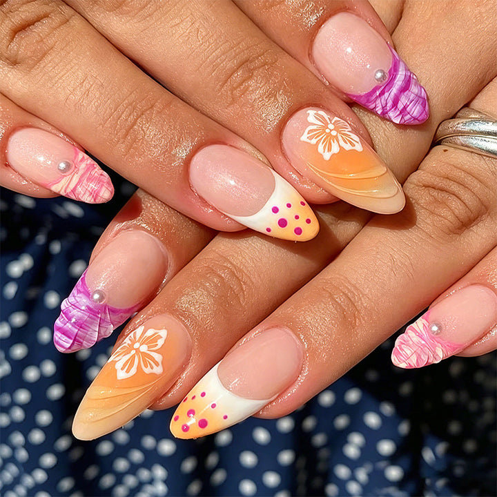 Acrylic nail set with exotic flower patterns and glitter accents Stornfield