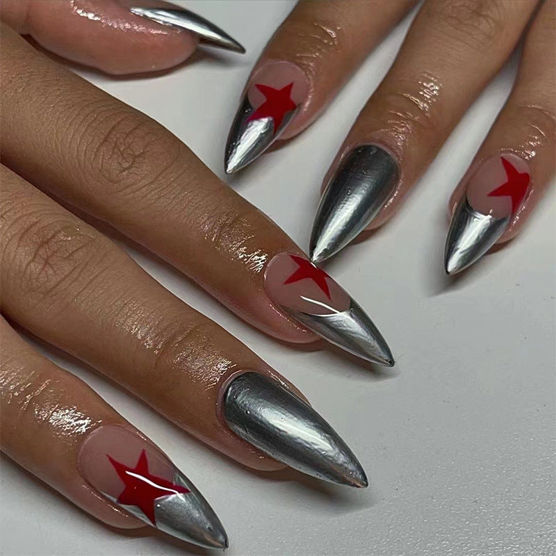 Artful stiletto nails with silver and star motifs Stornfield