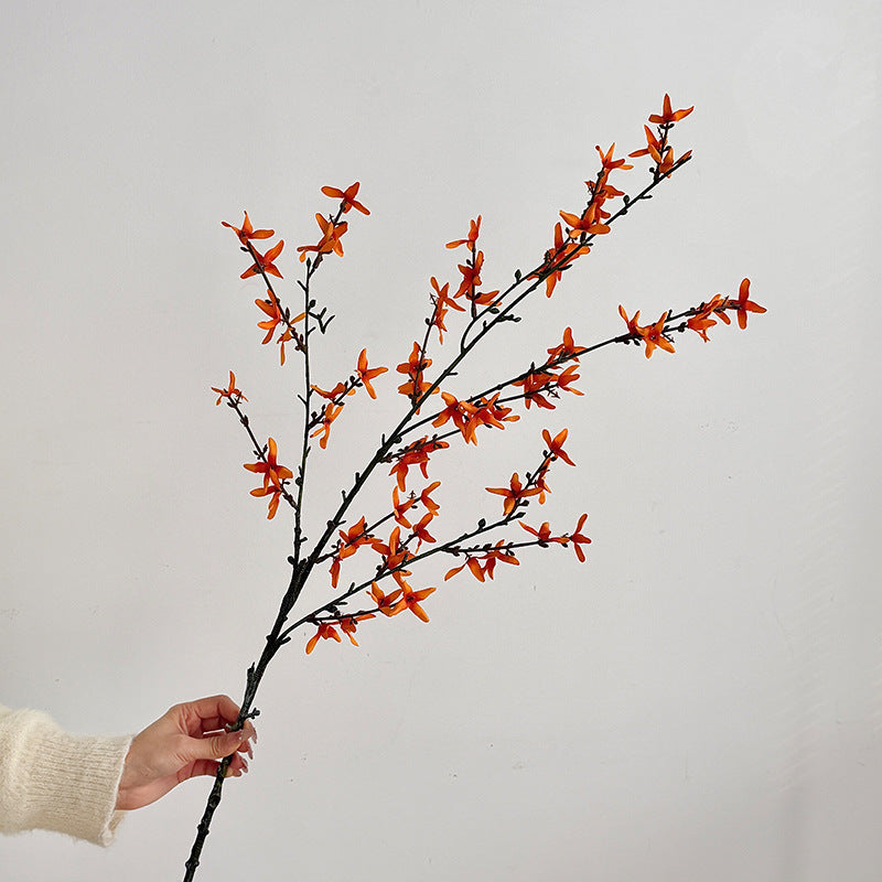 Artificial flower branch with intricately detailed yellow flowers