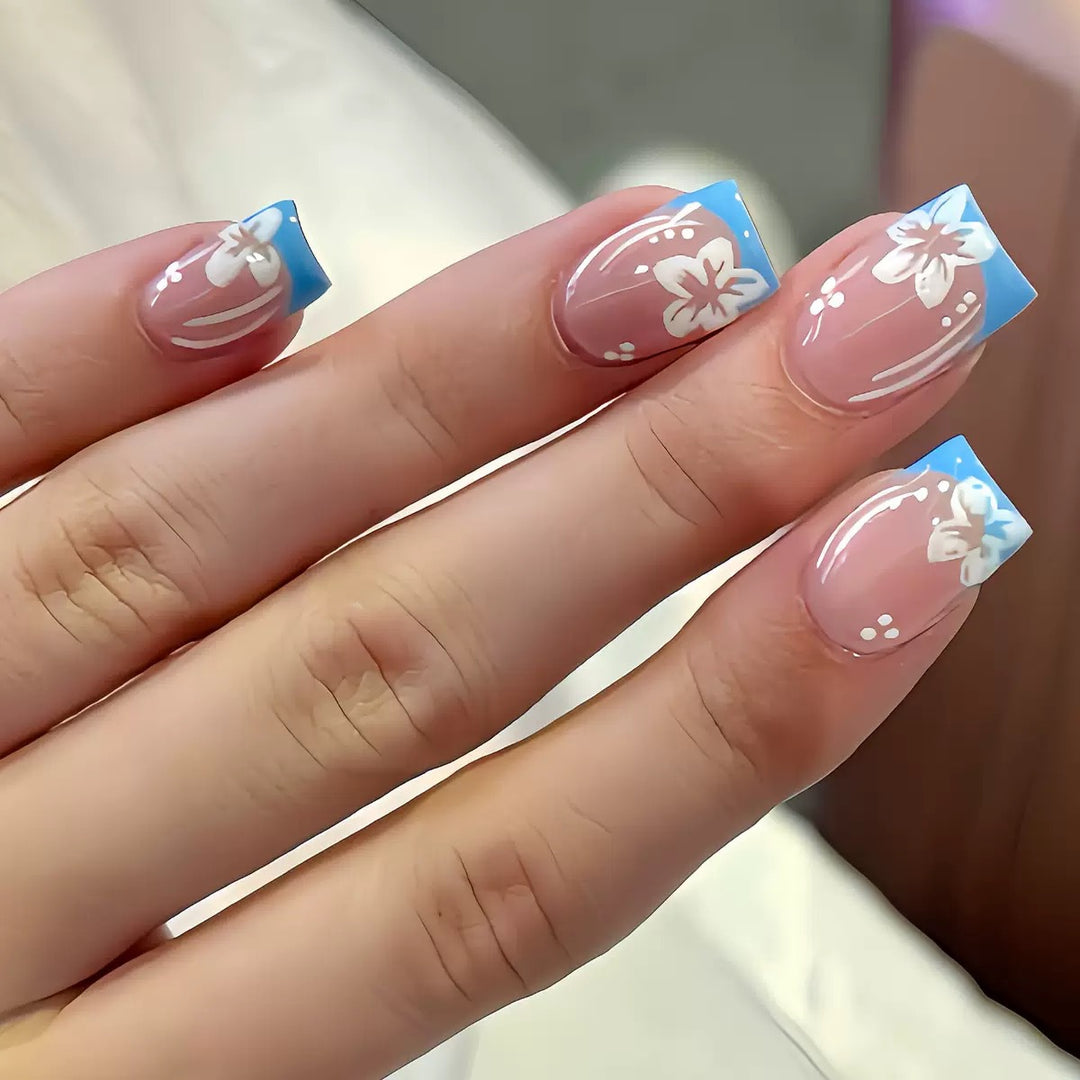 Acrylic nail set with floral designs and elegant tips Stornfield
