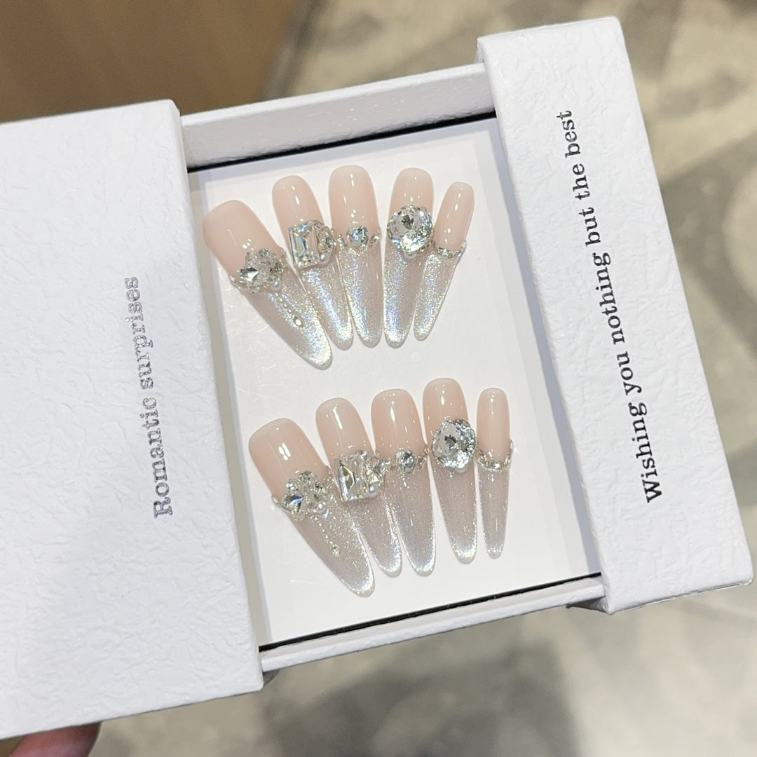 Glamorous artificial nails with sparkling rhinestone embellishments Stornfield