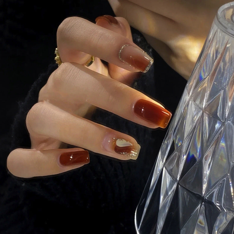 Elegant Glossy Press-On Nails with Gold Glitter Accents Stornfield