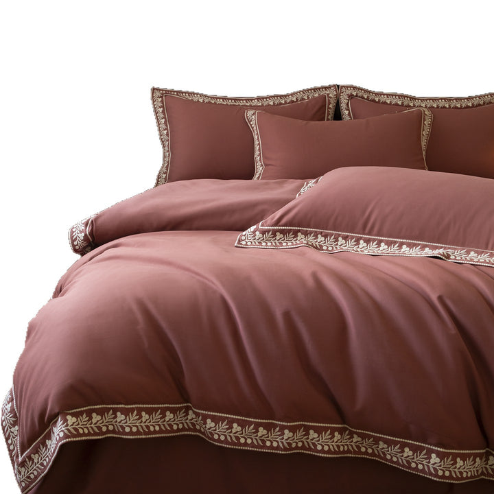 Luxurious embroidered bedding set in cotton satin with decorative trim