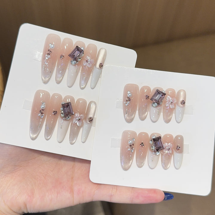 Artificial nails with elegant jewelry details Stornfield