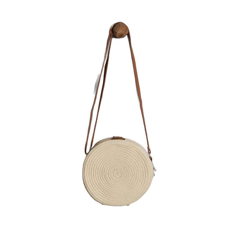 Round shoulder bag made of natural material with stylish accents Stornfield