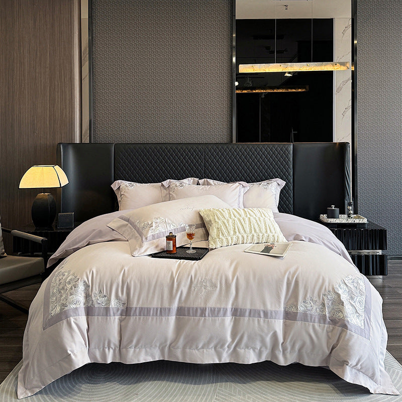Hotel-style bedding set made of cotton satin with embroidered rose relief and fine border
