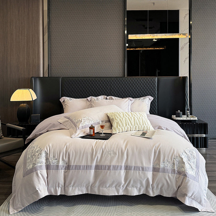 Hotel-style bedding set made of cotton satin with embroidered rose relief and fine border