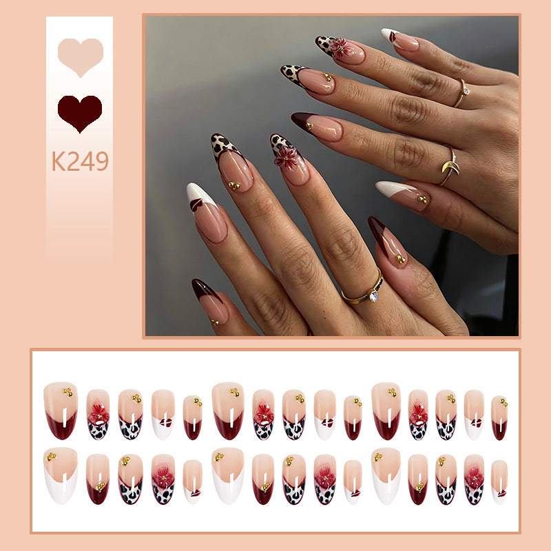 Artificial nail set with elegant floral patterns and glamorous details Stornfield