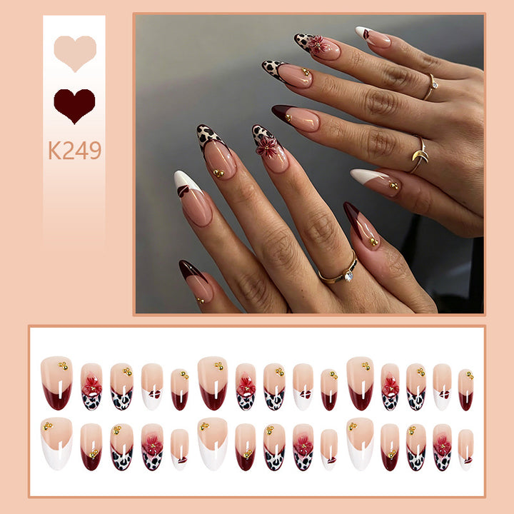 Artificial nail set with elegant floral patterns and glamorous details Stornfield