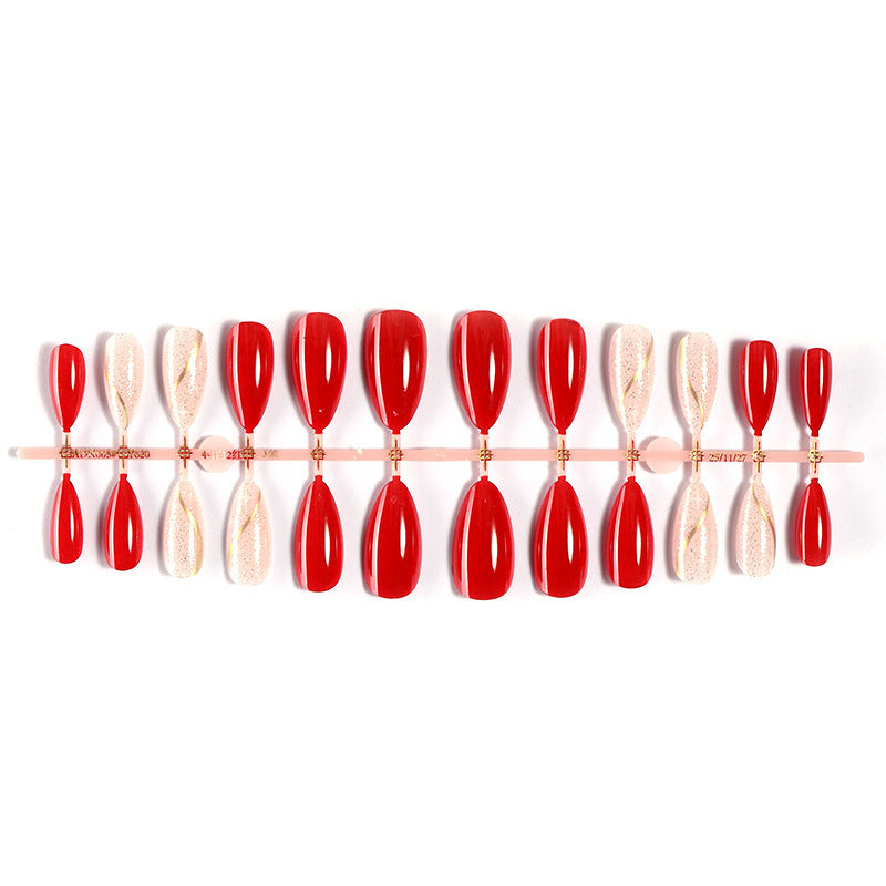 Artificial nail set with shiny red surface and stylish accents Stornfield