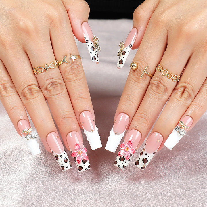 Acrylic nail set with elegant leopard design and floral accents Stornfield