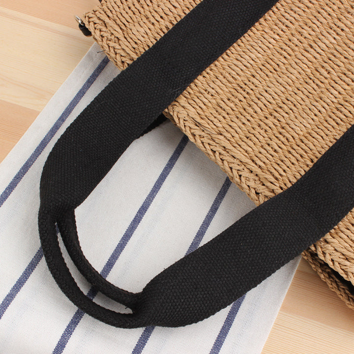 Handbag made of braided natural material with adjustable shoulder strap Stornfield