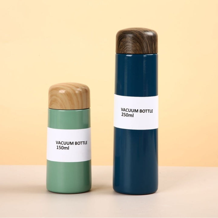 Women vacuum-insulated water bottle with innovative wooden lid Stornfield