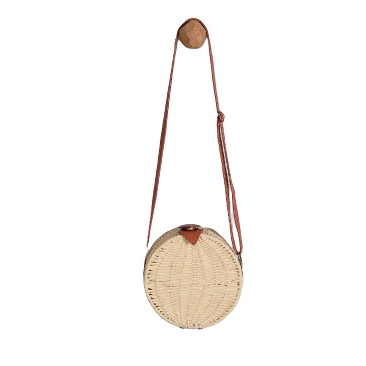 Round basket bag with leather accents Stornfield