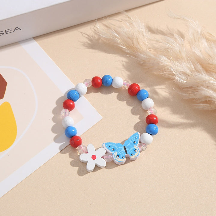 Playful bracelet with heart and butterfly charms Stornfield