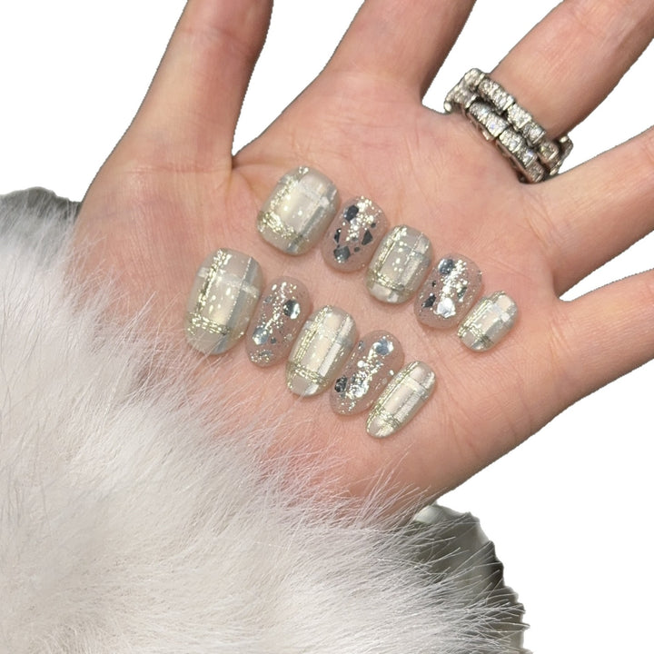 Glamorous artificial nail tips with metallic detail Stornfield