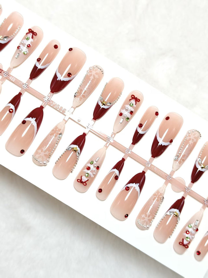 Artificial nails with festive designs and glitter accents Stornfield
