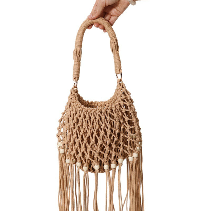 Macrame bag with decorative fringes and wooden beads Stornfield