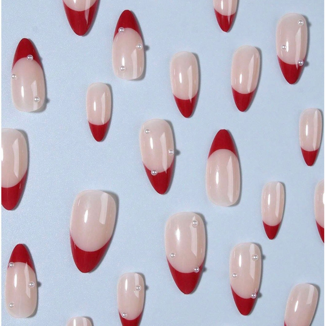 Acrylic nail set with elegant spike design and shimmering accents Stornfield
