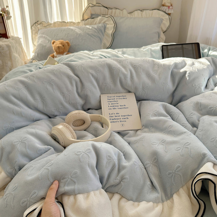 Cozy quilted bedding set with relief ribbon embroidery and contrasting ruffle edge