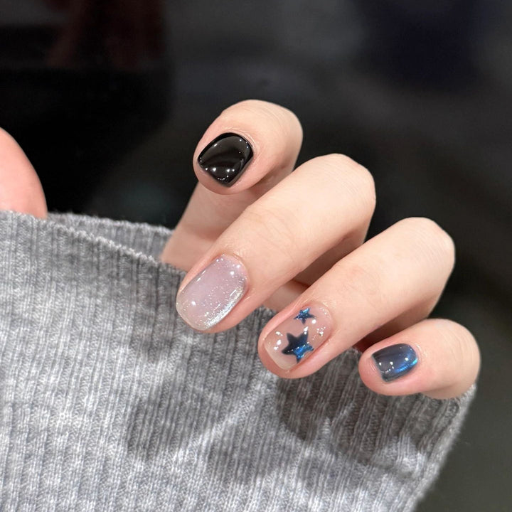 Artificial nails with elegant star design and shimmering effects Stornfield