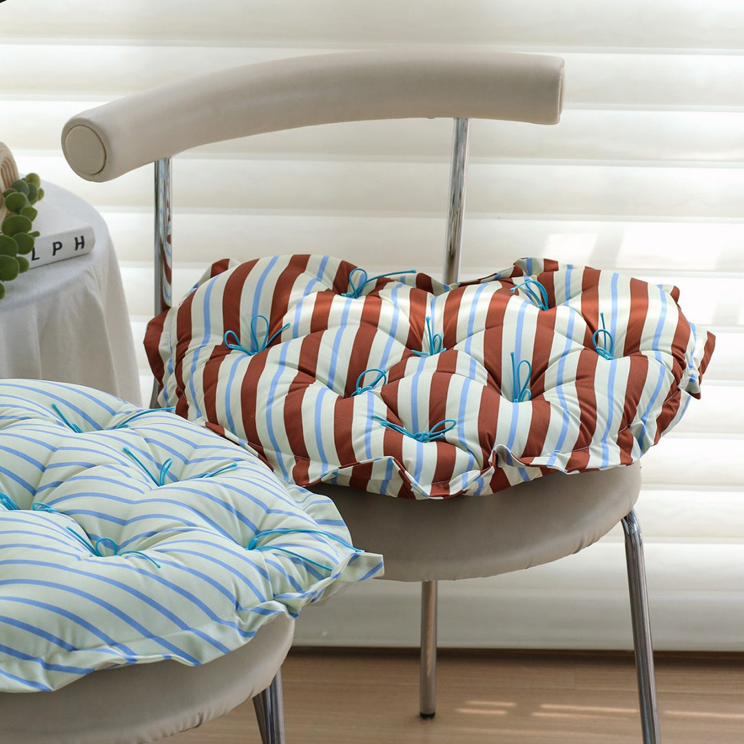 Heart-shaped floor cushion with quilted tufted upholstery and checkered satin cover Stornfield