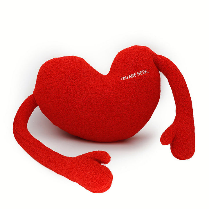 Cuddle pillow in heart shape with extra long arms made of sherpa fleece and embroidery detail