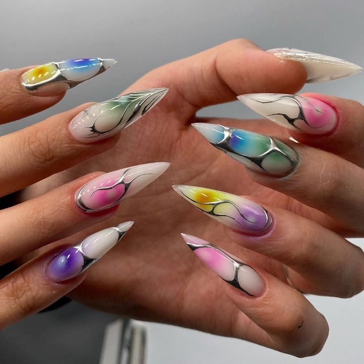 Artful stiletto nails with transparent design and colorful accents Stornfield