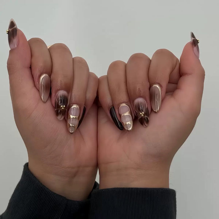 Artificial nail set with elegant ombre design and gold embellishments Stornfield