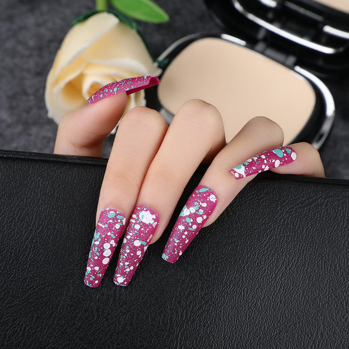 Artistic splatter design artificial nails Stornfield