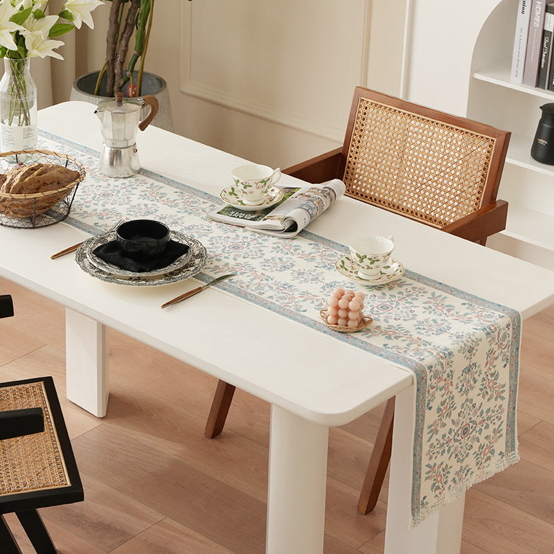 Woven jacquard table runner with floral medallion and fringes Stornfield