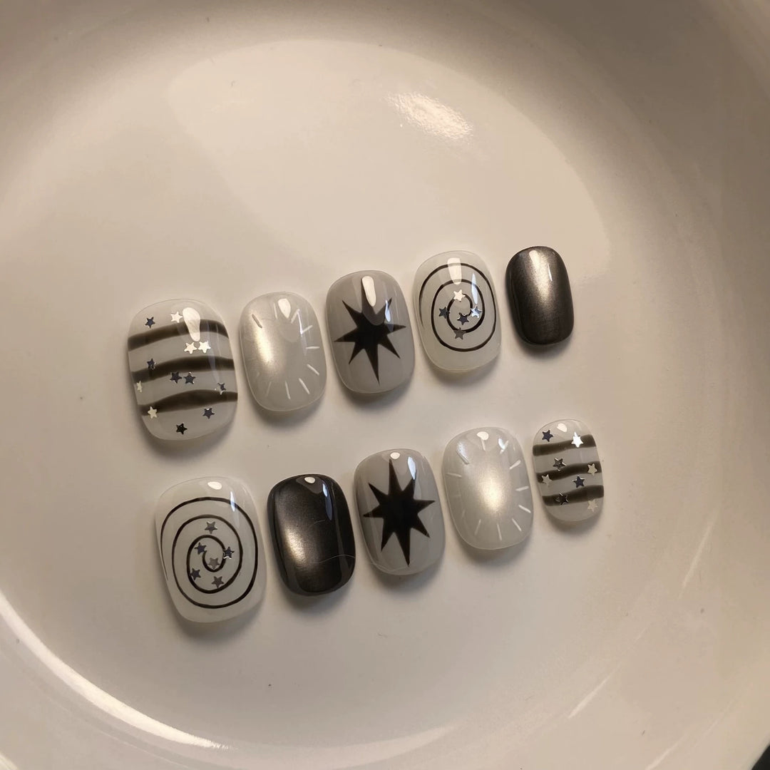 Artistic Press-On Nail Art Set with Celestial Designs