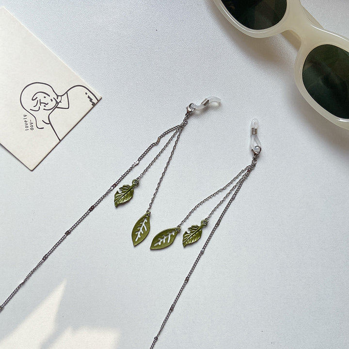 Fashionable glasses holder chain with leaf motifs Stornfield