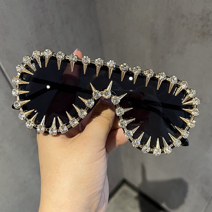 Ladies extravagantly designed cat-eye sunglasses with glitter accents Stornfield