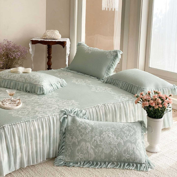 Romantic quilted bedspread set with jacquard floral pattern, ruffle and decorative cushion