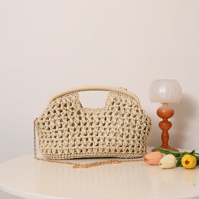 Handcrafted rattan bag with elegant handles and chain straps Stornfield